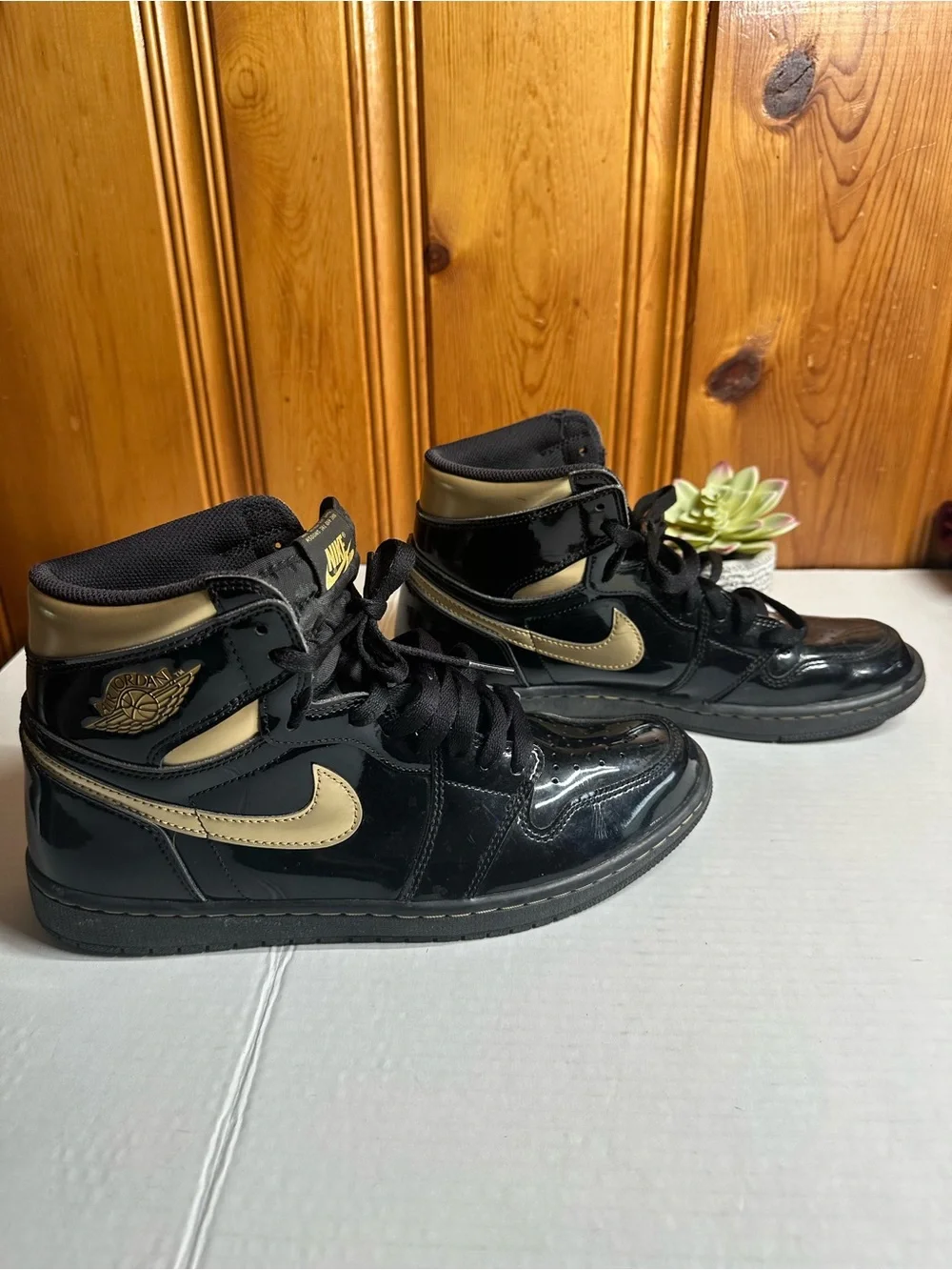 Nike Air High-Top Sneakers in Black with Gold Logo